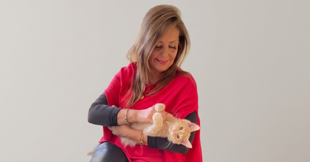 Holding a ginger kitten